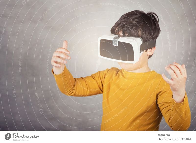 boy playing with virtual reality glasses on gray background Lifestyle Joy Playing Hardware Technology Entertainment electronics Science & Research Advancement