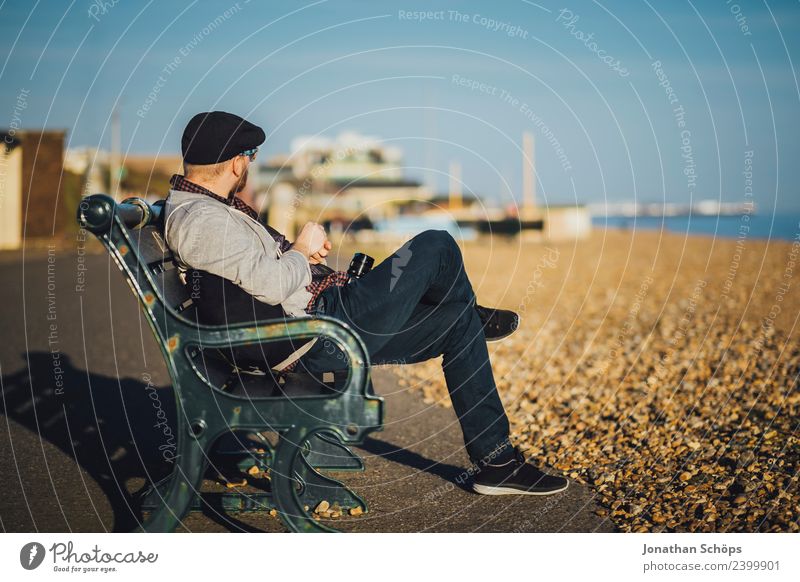 Tourist sits on a bench on the beach Vacation & Travel Tourism Trip Adventure Freedom Sightseeing City trip Sun Beach Ocean Photographer Masculine 1 Human being