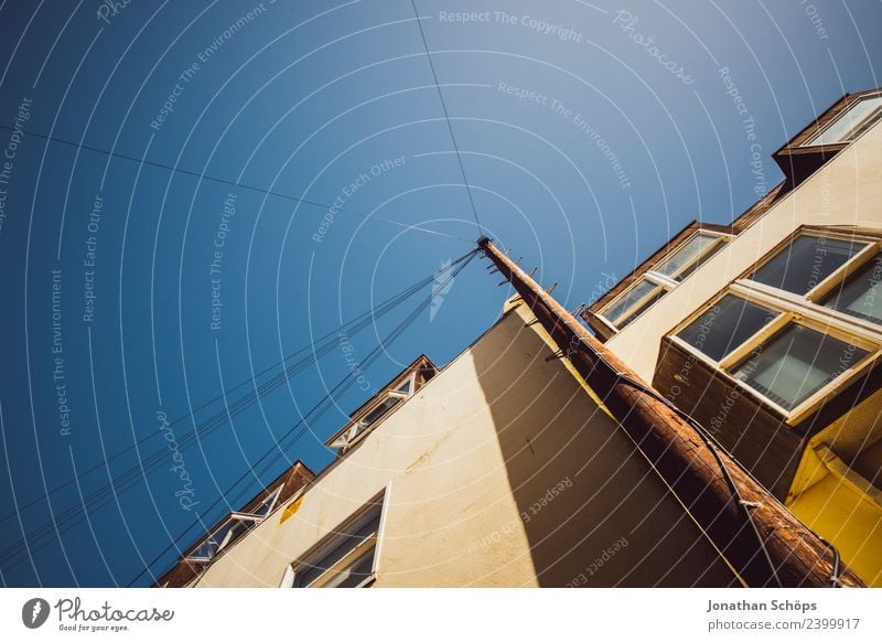 Above the roofs VII Sky Cloudless sky Sun Brighton Great Britain Europe Town Port City House (Residential Structure) Facade Window High voltage power line Blue