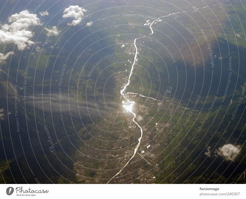 focal point Nature Landscape Earth Air Sky Clouds Mountain Aviation View from the airplane Flying Brown Green Silver White Vacation & Travel Valley Colour photo