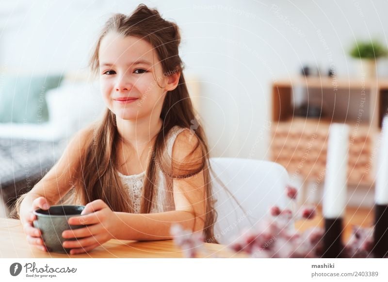 happy 5 years old kid girl having breakfast Nutrition Breakfast Hot Chocolate Tea Lifestyle Happy Table Kitchen Child Infancy Smiling Sit Authentic Modern