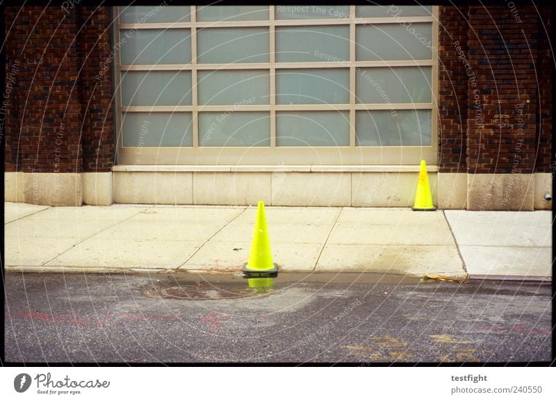 neon yellow Deserted Wall (barrier) Wall (building) Facade Traffic infrastructure Street Signs and labeling Signage Warning sign Yellow Safety Neon Colour photo