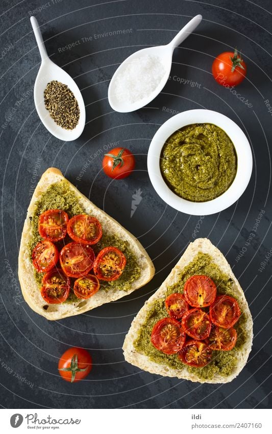 Bread Roll with Pesto and Roasted Tomato Vegetable Breakfast Fresh Healthy food olive pesto roasted topping Spread Sauce Basil salt pepper condiment Snack