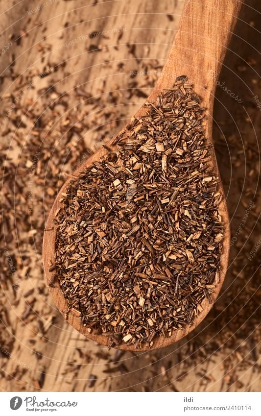 Rooibos Herbal Tea on Wooden Spoon Herbs and spices Beverage Red food drink rooibos bush Red bush rooibosch herbal dry African Dried Rustic overhead Vertical