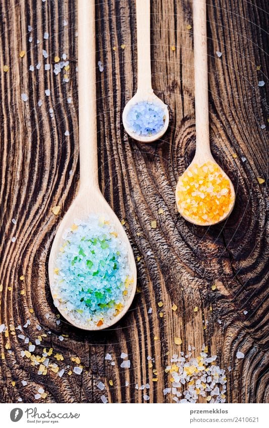 Colorful sea salt in wooden spoons put on old wooden table Spoon Lifestyle Body Skin Medical treatment Wellness Relaxation Spa Ocean Table Nature Container Wood