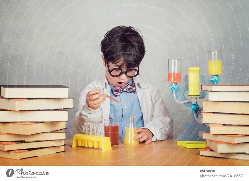 boy is making science experiments in a laboratory Lifestyle Education Science & Research School Study Student Laboratory Human being Masculine Child Toddler