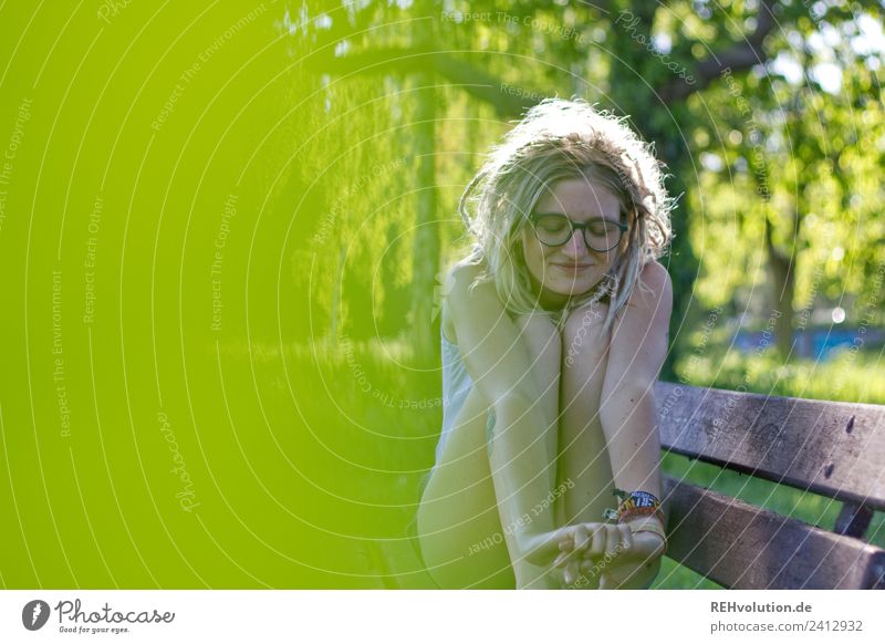 Young woman with dreads sitting on a bench Human being Adults Relaxation Feminine Contentment Well-being Calm Lifestyle Leisure and hobbies Youth (Young adults)