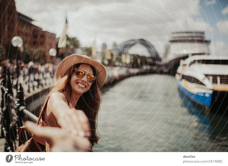 Happy woman holding her boyfriend hand in Sydney Lifestyle Joy Vacation & Travel Trip Adventure City trip Summer vacation Human being Woman Adults Couple 2