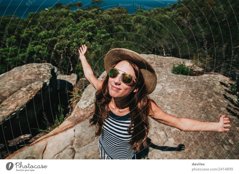 Happy white woman with opened arms breathing and enjoying the sun in the Australian forest. Lifestyle Joy Beautiful Wellness Leisure and hobbies