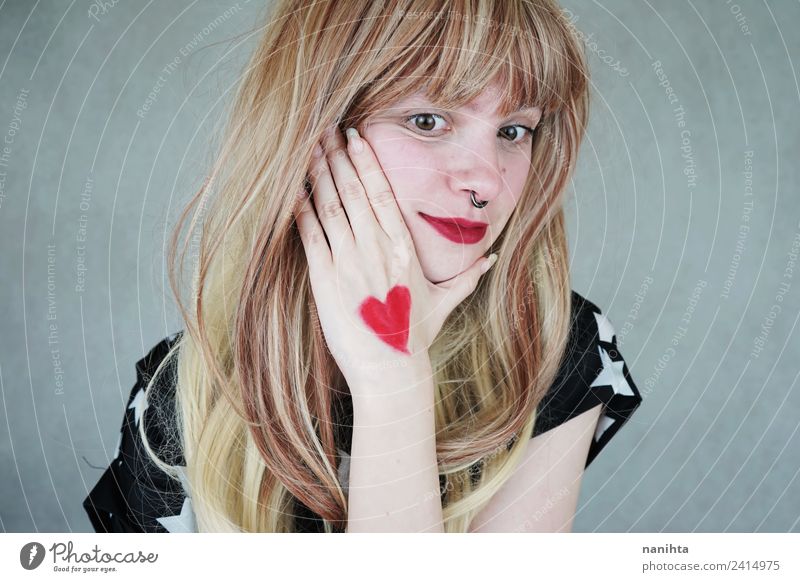 Young blonde woman with a heart painted in her hand Style Design Joy Beautiful Hair and hairstyles Healthy Wellness Senses Valentine's Day Human being Feminine