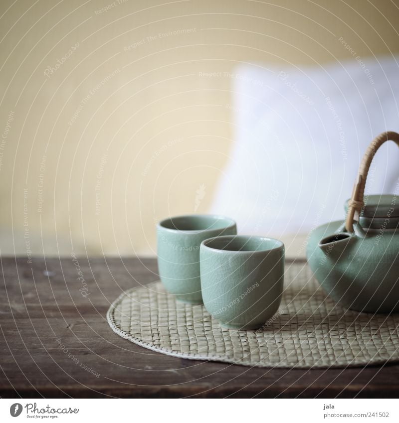 tee Beverage Hot drink Tea Crockery Teapot Living or residing Flat (apartment) Armchair Table Relaxation Interior shot Deserted Copy Space top Day