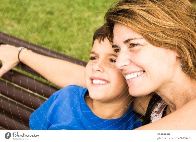 Mother and son seated on a park Lifestyle Joy Happy Beautiful Child Baby Boy (child) Woman Adults Parents Family & Relations Infancy Nature Park Smiling Love