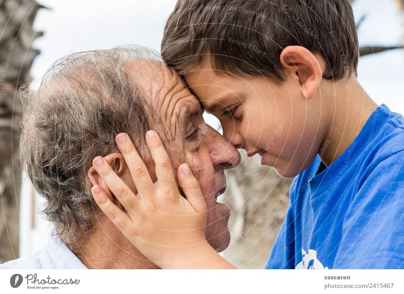 Grandson giving a hug to his grandson. Face to face Joy Happy Playing Child Human being Boy (child) Man Adults Grandfather Family & Relations Infancy Old