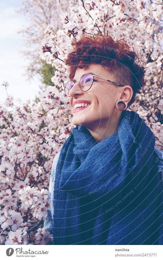 Beautiful redhead woman against an almond tree in bloom Lifestyle Style Joy Hair and hairstyles Wellness Well-being Human being Feminine Young woman