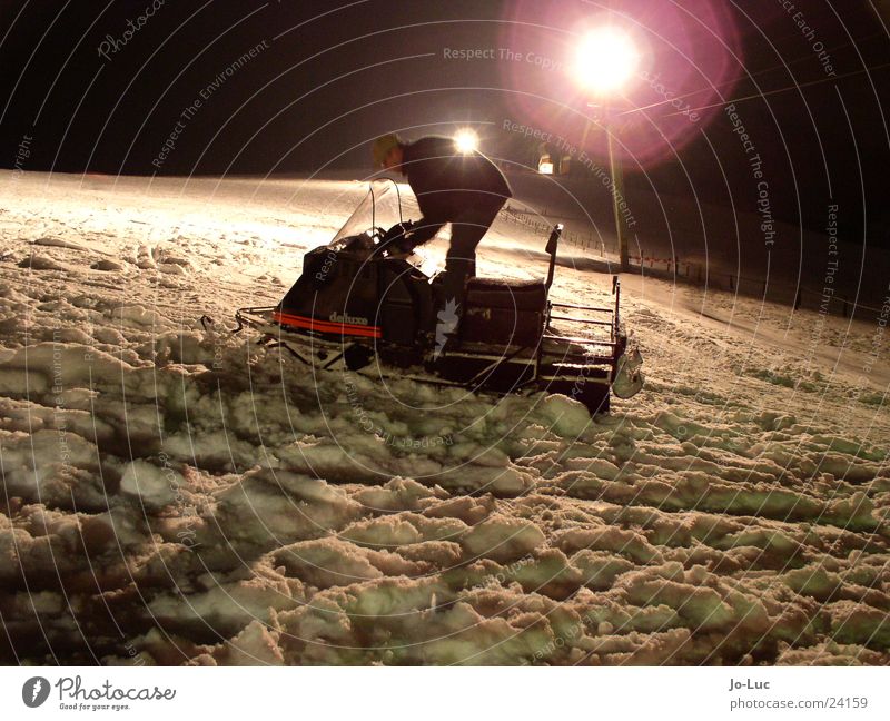 final lap Night Transport Snow Mountain Ski run snowmobile