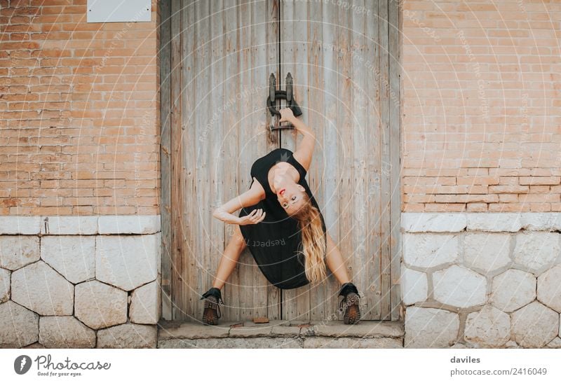 White blonde woman in black dress performing contemporary dance in the street. Elegant Style Beautiful Entertainment Dance Human being Young woman