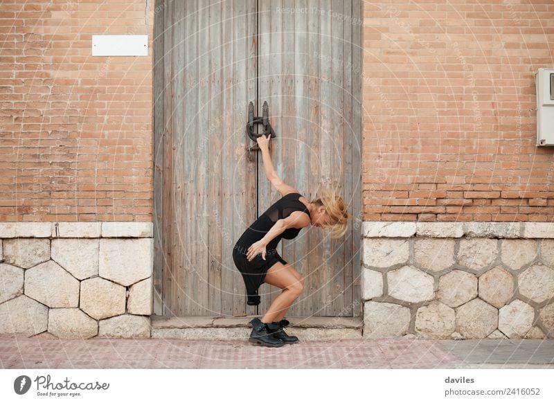 White blonde woman performing contemporary dance in the street. Lifestyle Elegant Style Sports Fitness Sports Training Human being Young woman