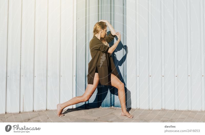 Blonde woman posing and performing contemporary dance in the street. Lifestyle Joy Dance Fitness Sports Training Human being Young woman Youth (Young adults)