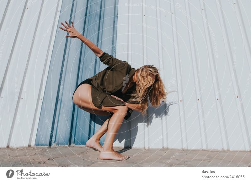 Blonde and long hair woman performing contemporary dance with energy. Lifestyle Style Beautiful Leisure and hobbies Dance Sports Human being Young woman