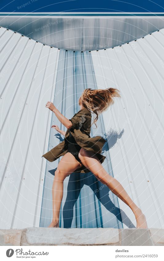 Action portrait of blonde and long hair dancer in front of a wall. Lifestyle Beautiful Human being Woman Adults Body 1 18 - 30 years Youth (Young adults) Art