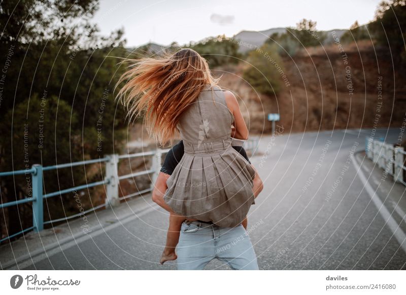 Couple celebrating love in the countryside. Lifestyle Joy Woman Adults Man Arm 2 Human being 18 - 30 years Youth (Young adults) Nature Forest Bridge Dress