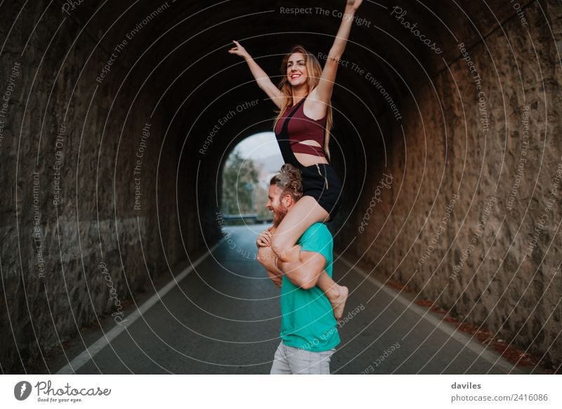 Man carrying his girlfriend on his shoulders. Lifestyle Joy Vacation & Travel Trip Human being Woman Adults Couple 2 18 - 30 years Youth (Young adults) Street