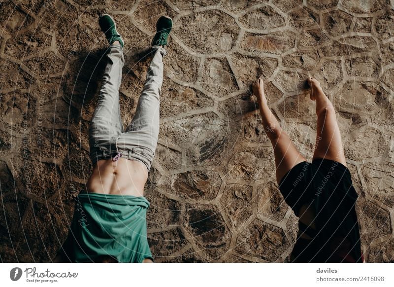 Young couple doing a handstand Joy Beautiful Vacation & Travel Human being Woman Adults Man Couple 2 18 - 30 years Youth (Young adults) Forest Tunnel Stone