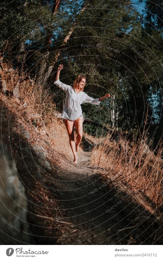 Woman in her back enjoying a walk in nature Lifestyle Happy Mountain Hiking Human being Adults 1 18 - 30 years Youth (Young adults) Dancer Nature Landscape Park