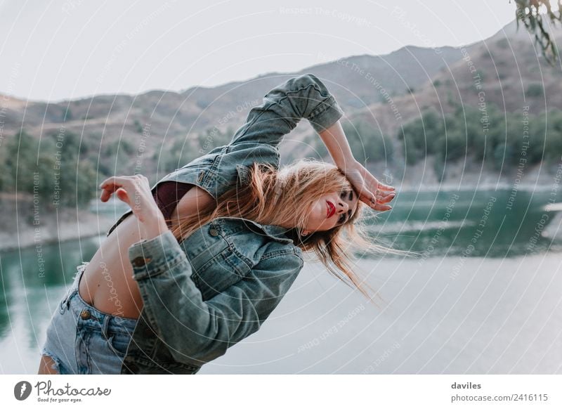 Woman in shorts and jacket posing in nature Lifestyle Style Beautiful Face Mountain Human being Adults 1 18 - 30 years Youth (Young adults) Dancer Youth culture