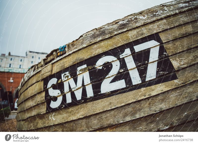 old fishing boat on the beach Environment Esthetic Brighton Navigation Watercraft Fishing boat Digits and numbers Name Denote England Ocean Beach Harbour Old