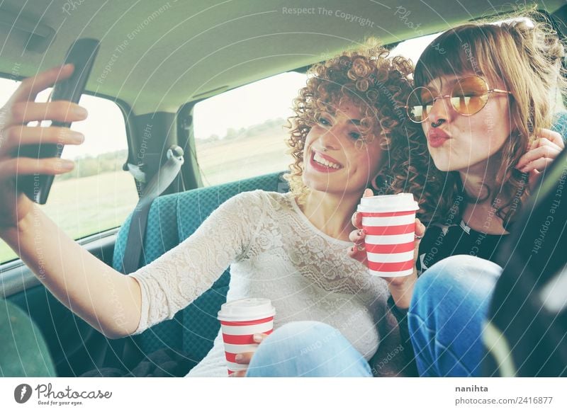 Two young friends taking a selfie and drinking coffee Beverage Hot drink Coffee Lifestyle Style Design Joy Vacation & Travel Tourism Trip Cellphone Technology