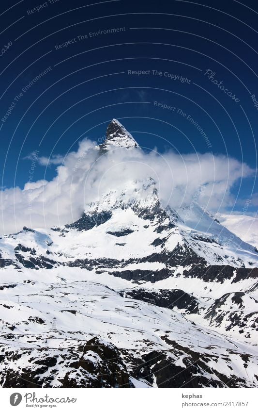 Matterhorn in clouds Nature Landscape Sky Clouds Winter Snow Rock Alps Mountain Peak Snowcapped peak Zermatt Switzerland Deserted Landmark Hiking Esthetic