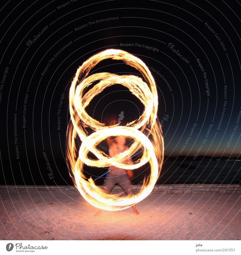 fire staff Joy Leisure and hobbies fire stick Juggler Acrobat Human being Masculine Man Adults 1 Landscape Night sky Sand Esthetic Fire piece of art Shows