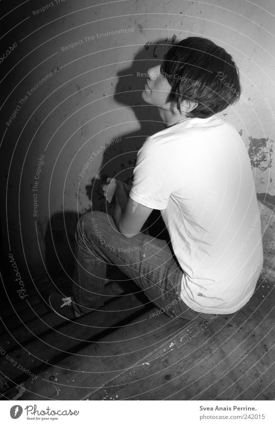 a drop shadow. Masculine 1 Human being 18 - 30 years Youth (Young adults) Adults Jeans T-shirt Sit Sadness Concern Grief Stairs Trashy Dirty Black & white photo