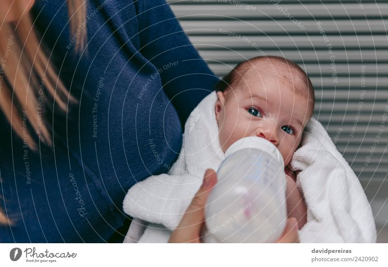 Baby taking feeding bottle Eating Bottle Lifestyle Beautiful Face Bedroom Child Human being Woman Adults Mother Family & Relations Infancy Feeding Love Growth