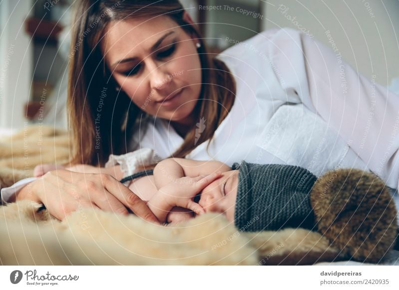 Newborn baby girl sleeping lying on blanket with her mother Beautiful Calm Bedroom Child Human being Baby Woman Adults Mother Family & Relations Hand Hat Love