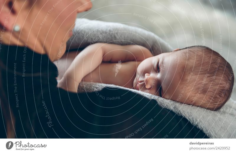 Baby wrapped embraced by her mother Lifestyle Beautiful Living room Child Human being Woman Adults Mother Family & Relations Warmth Smiling Love Sleep Embrace