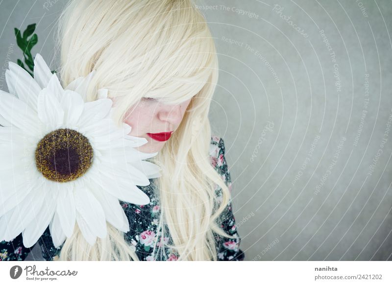 Young blonde woman posing near a huge flower Elegant Style Beautiful Hair and hairstyles Skin Face Lipstick Human being Feminine Young woman