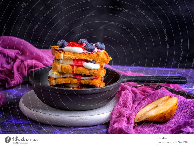 French toast with berries Fruit Bread Dessert Breakfast Pan Table Fresh Delicious Black White french cream food background Cast iron vintage Rustic Pear Syrup