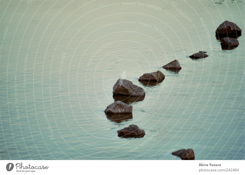 stone chain Water River bank Swimming & Bathing Cold Wet Blue Gray Black Stone Unwavering Colour photo Exterior shot Deserted Copy Space left Evening