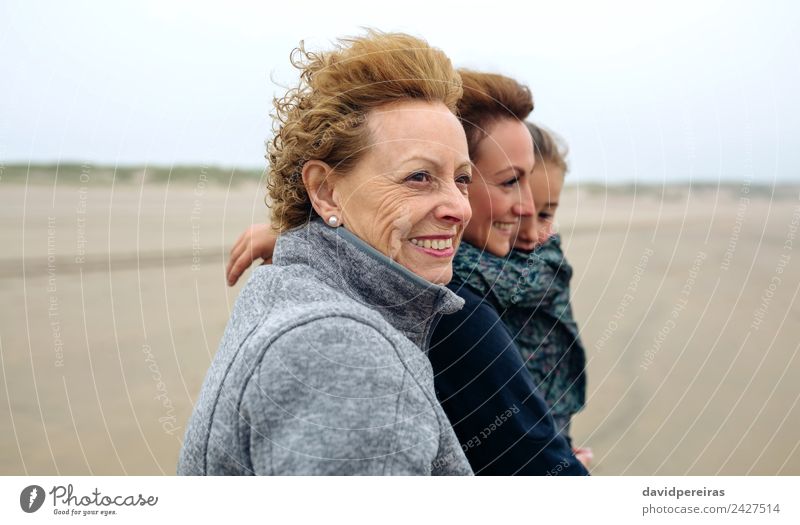 Three generations female walking on the beach Lifestyle Joy Happy Beautiful Beach Ocean Child Human being Woman Adults Mother Grandmother Family & Relations