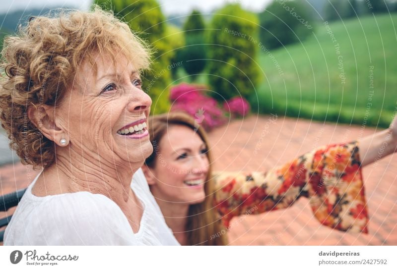 Senior woman in wheelchair laughing with her daughter Lifestyle Happy Health care Relaxation Garden Human being Woman Adults Mother Grandmother