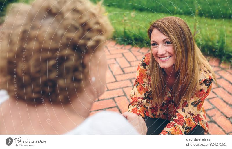 Young woman caring elderly woman in garden Lifestyle Happy Health care Relaxation Garden To talk Human being Woman Adults Mother Grandmother Family & Relations