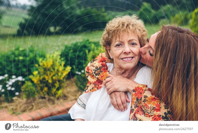 Senior woman in a wheelchair with daughter in garden Happy Health care Garden Human being Woman Adults Mother Grandmother Family & Relations Nature Plant Tree