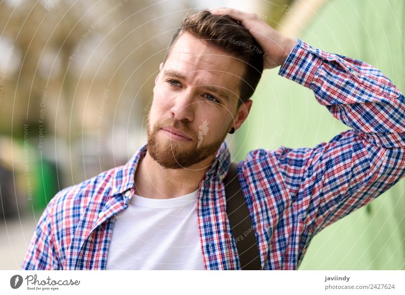 Thoughtful young man standing in urban background Lifestyle Style Happy Vacation & Travel Human being Masculine Young man Youth (Young adults) Man Adults 1