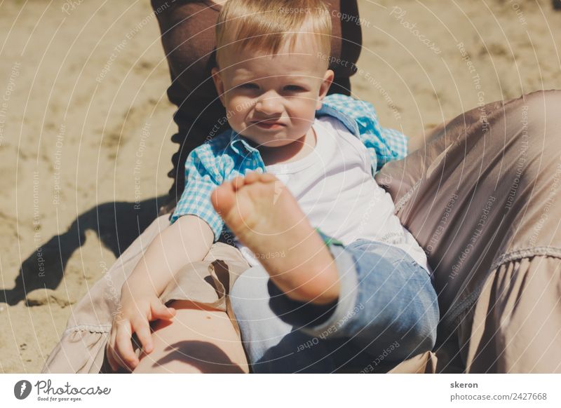 little boy sits on his mother's arms and shows his leg Wellness Harmonious Leisure and hobbies Vacation & Travel Adventure Parenting Child Baby Toddler