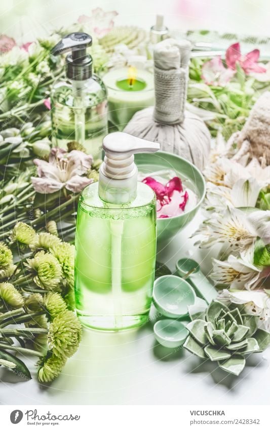 Green cosmetics bottle with flowers and spa accessories Style Design Beautiful Personal hygiene Cosmetics Cream Healthy Health care Medical treatment Wellness