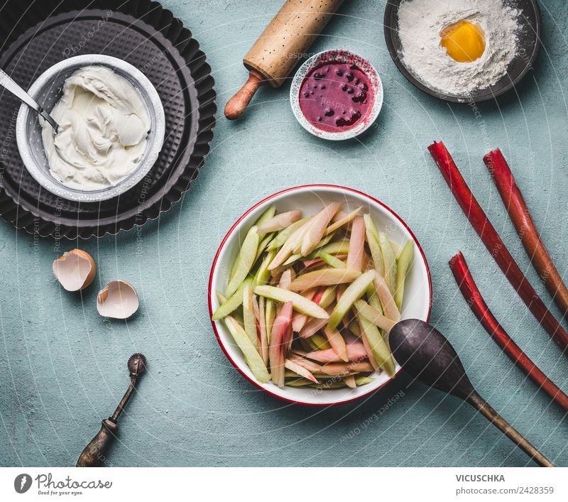 Cut rhubarb in the bowl on the kitchen table Vegetable Fruit Cake Nutrition Organic produce Vegetarian diet Crockery Style Design Healthy Living or residing