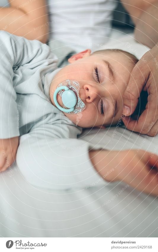 Baby asleep while parents caress Lifestyle Beautiful Calm Child Human being Toddler Boy (child) Woman Adults Man Parents Mother Father Family & Relations