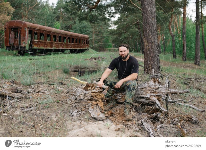 bearded woodsman with an axe sitting next to rusty train Human being Masculine Young man Youth (Young adults) Adults Hair and hairstyles Face Eyes Nose Mouth